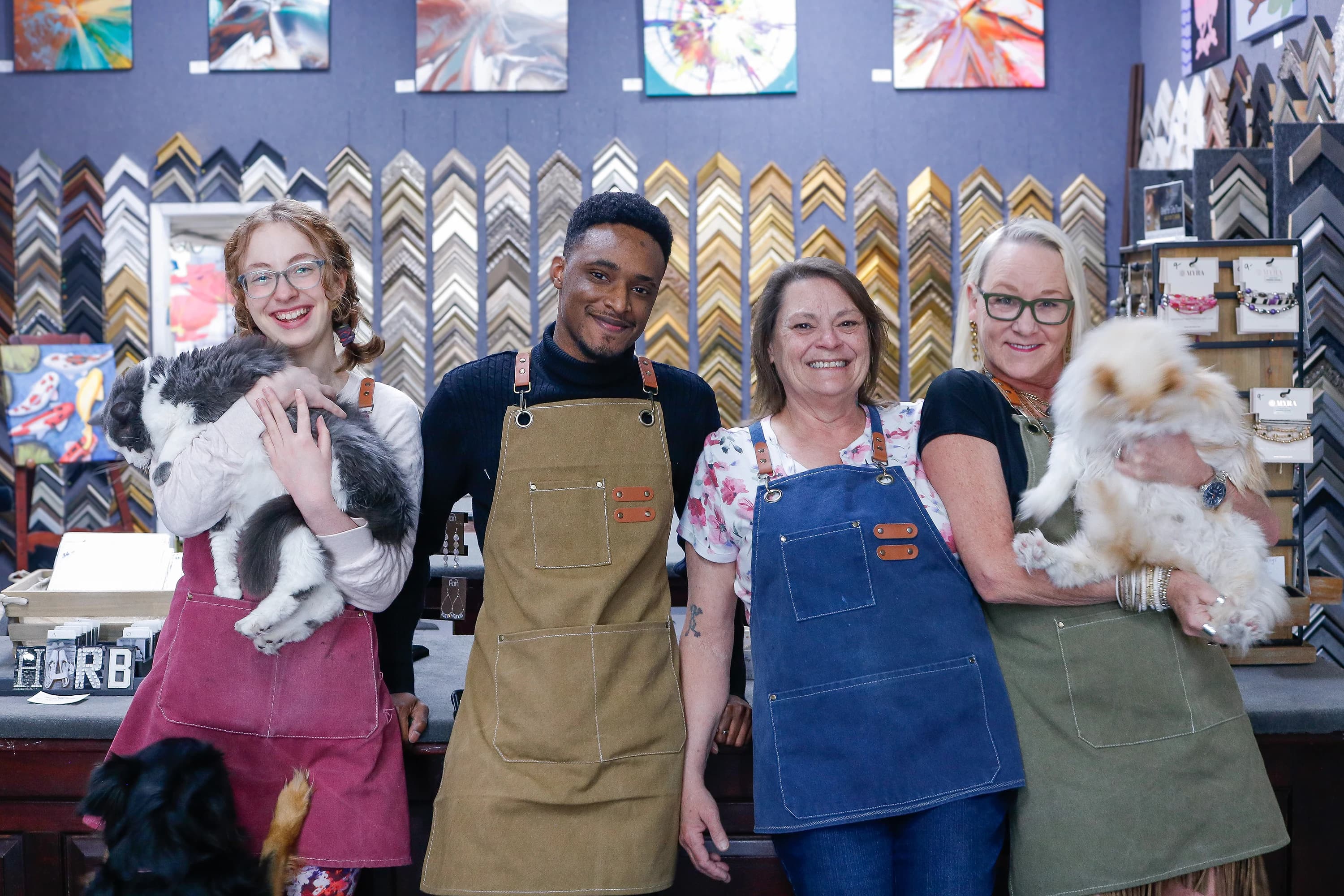 Harbor Gallery framers picking molding for a koi painting